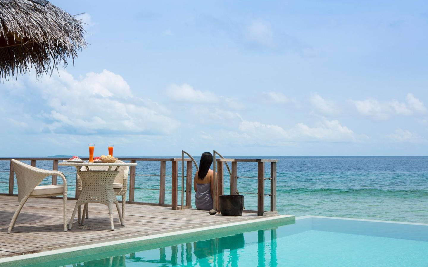 dusit-thani-maldives-accommodation-two-bedroom-ocean-pavilion-bedroom-lifestyle