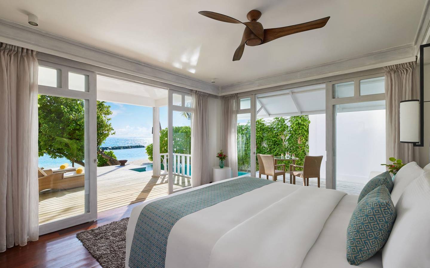 NH_Maldives_Kuda_Rah_Resort_Two_Bedroom_Duplex_Beach_Villa_with_Private_Pool_Bedroom_Looking_Out(1)