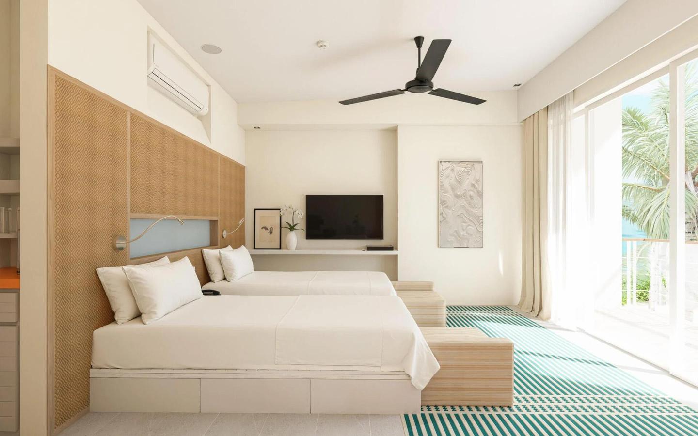 4_Kandooma_Maldives_Two-Bedroom-Beach-House_Sea-View-with-Pool-Living